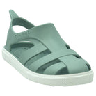 Green sandal with white sole on a white background