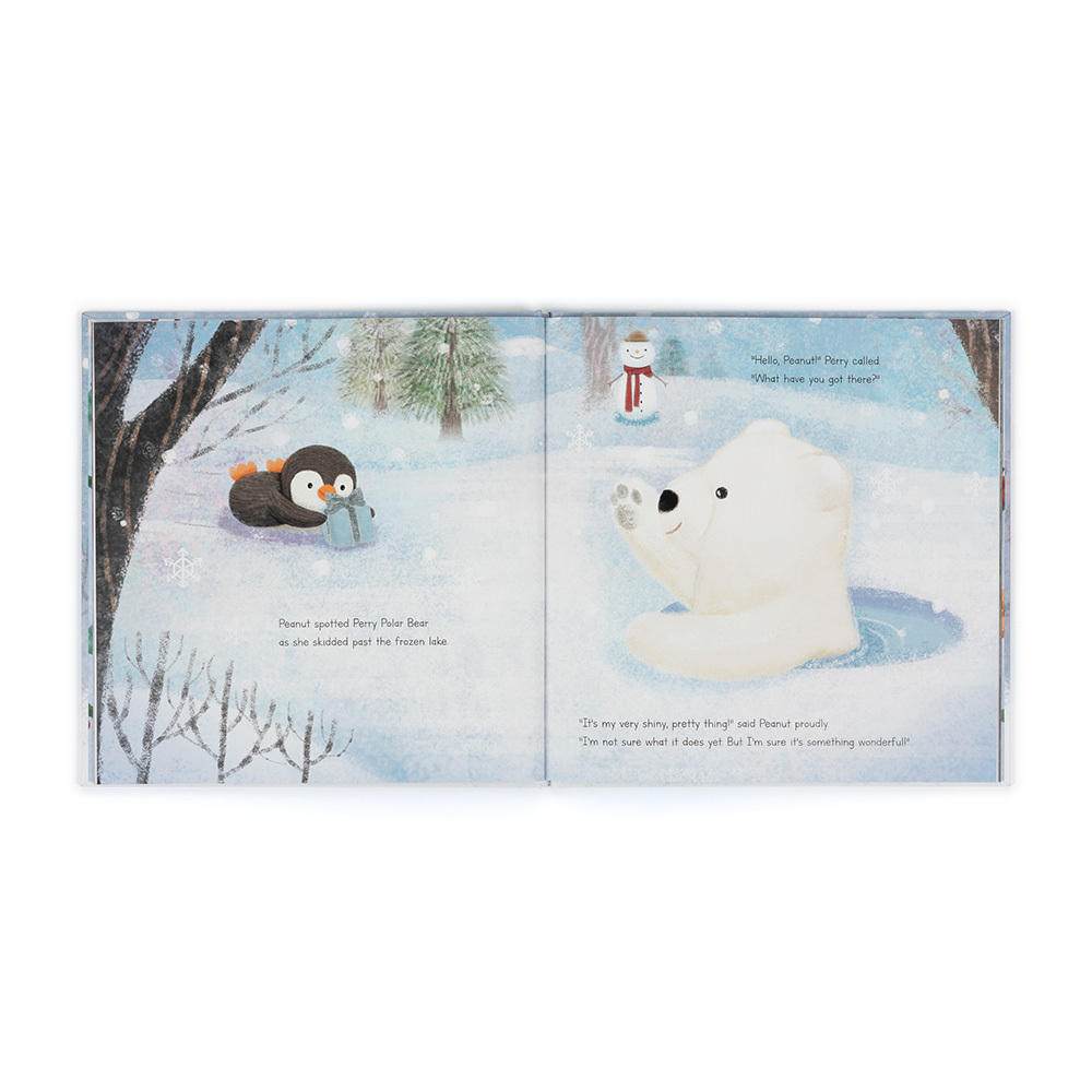 Open book showing two pages with a penguin and a polar bear in a snowy landscape.