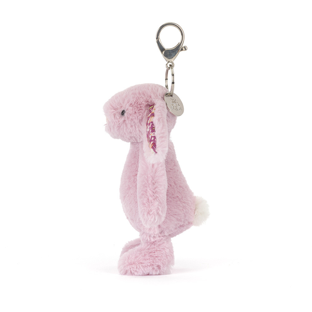 Pink plush bunny keychain on a white background