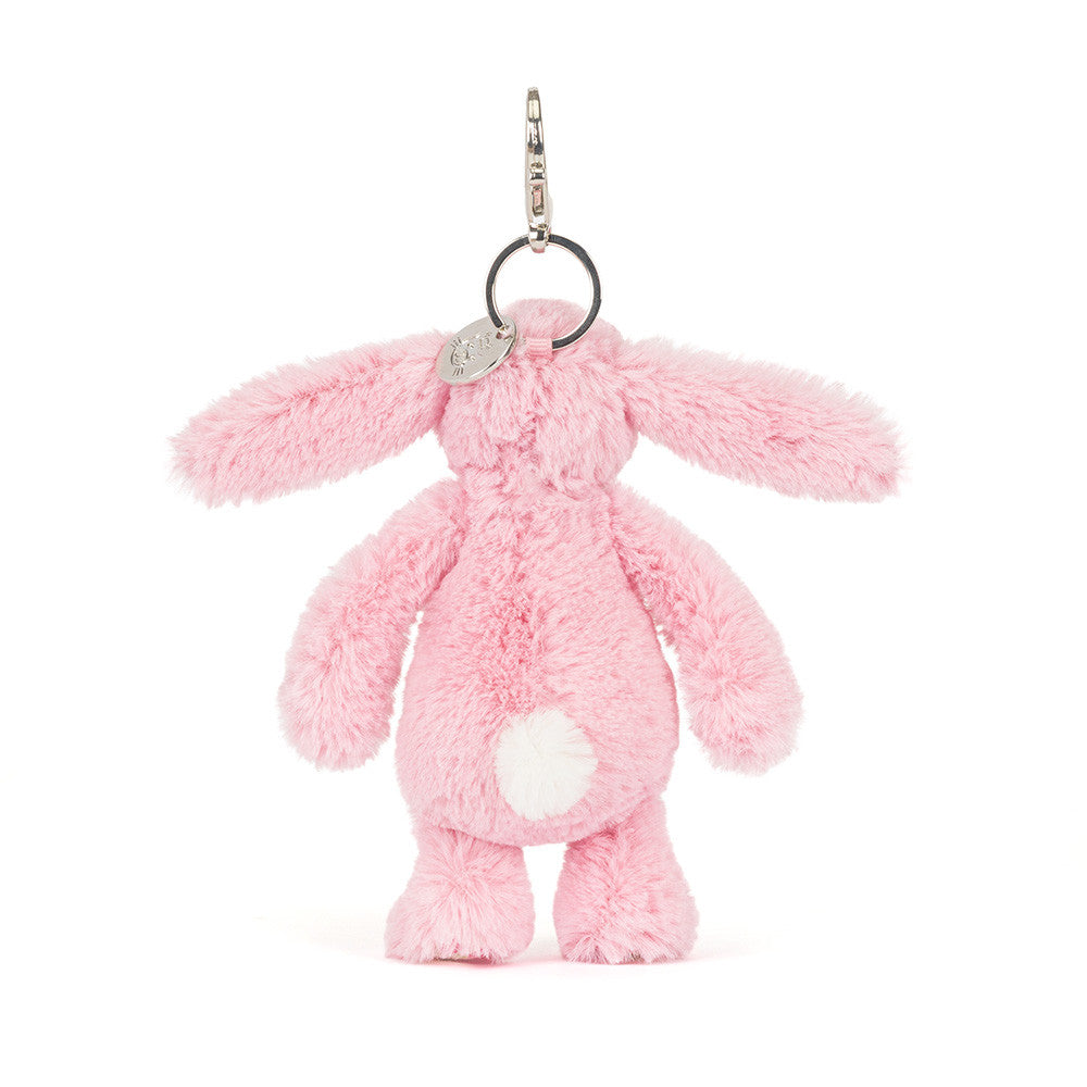 Pink plush bunny keychain on a white background