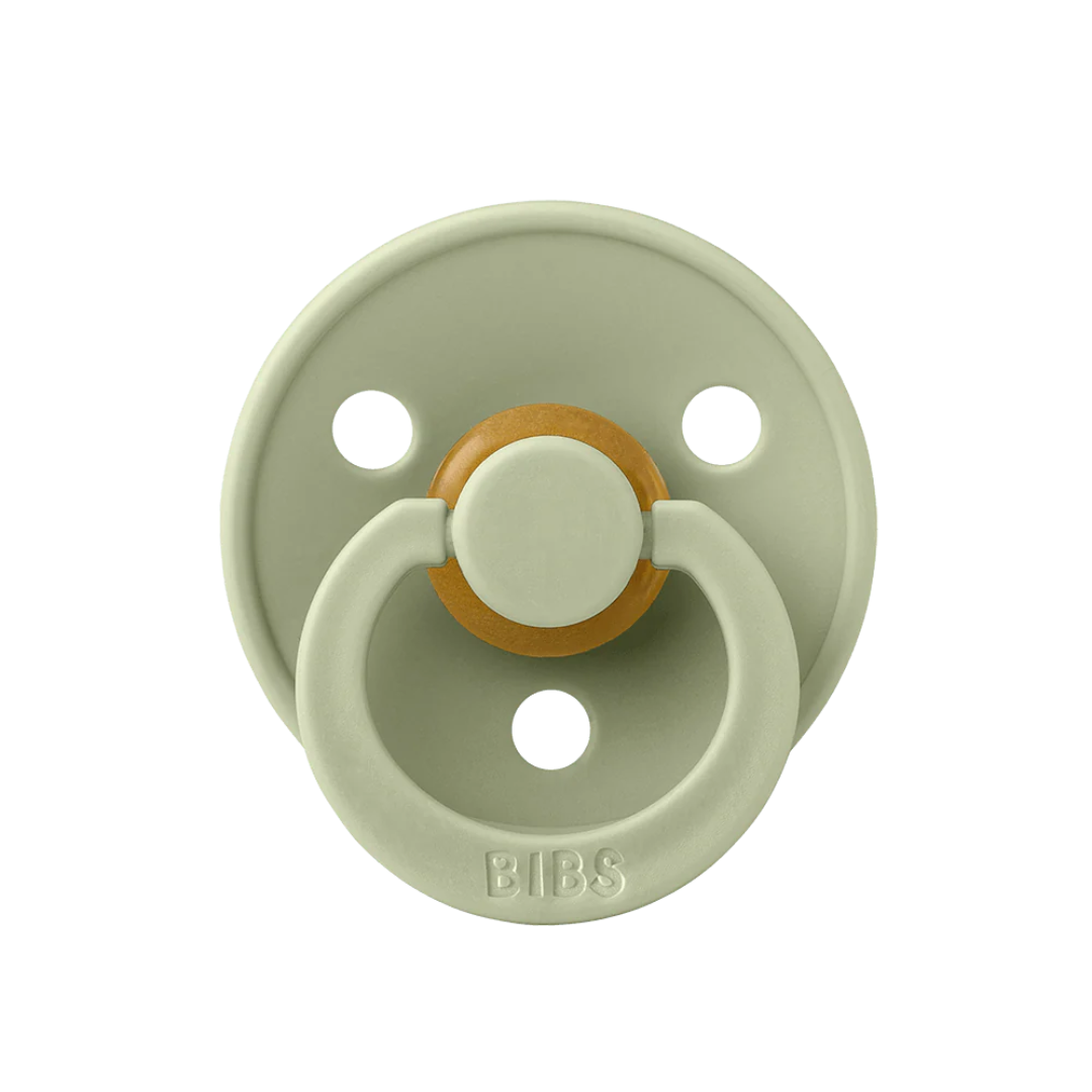 A BIBS pacifier in sage green with a natural bamboo center, shown against a solid white background.