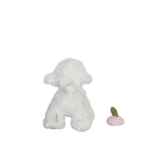 White plush dog toy with a pink and green object on a white background