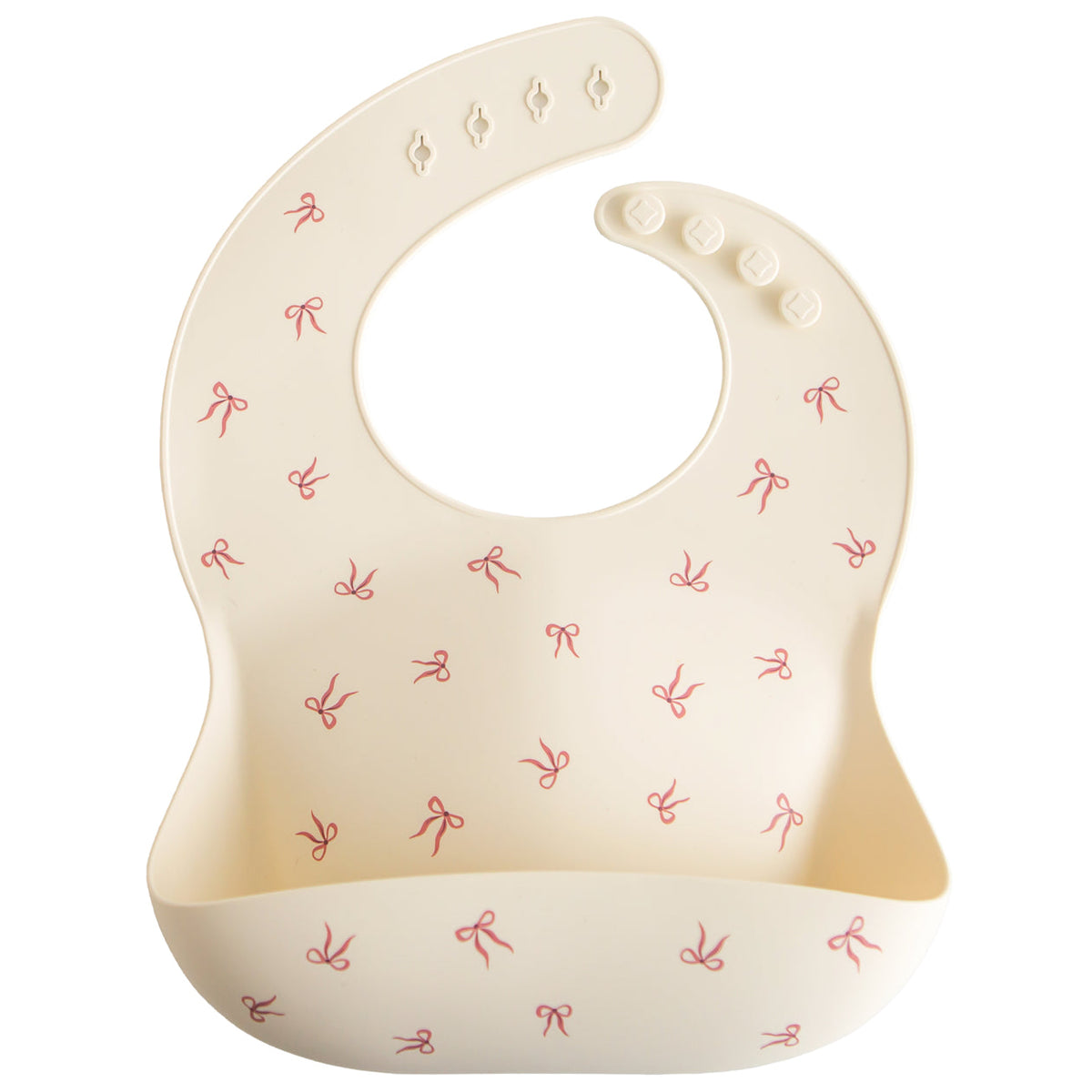Beige baby bib with red bow pattern on a white background