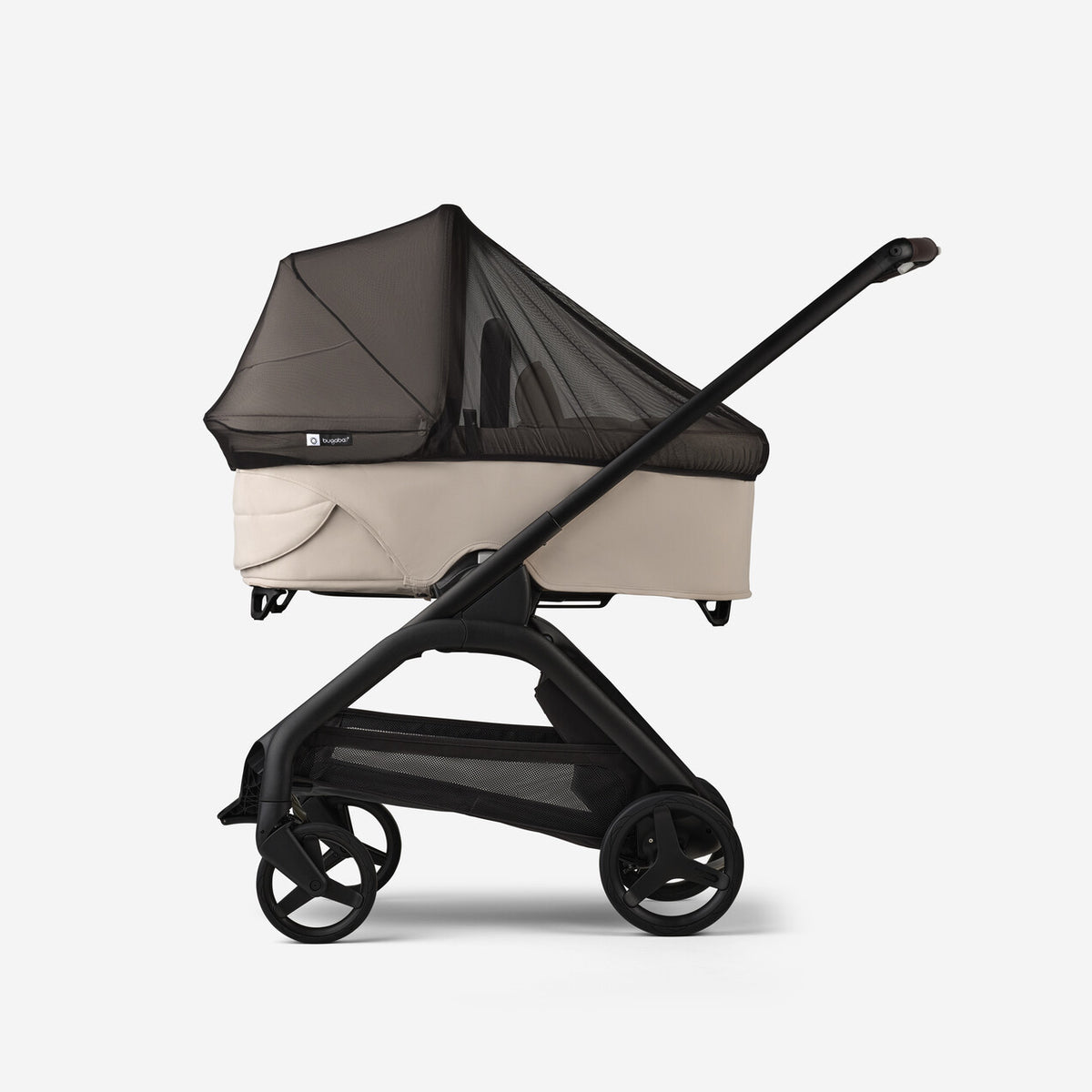 Baby stroller with beige seat and black frame on a white background