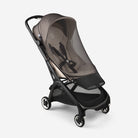 Black and transparent baby stroller on a white background