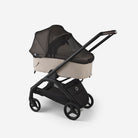 Black and beige stroller on a white background