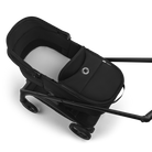 Black baby stroller with white cushion on a transparent background