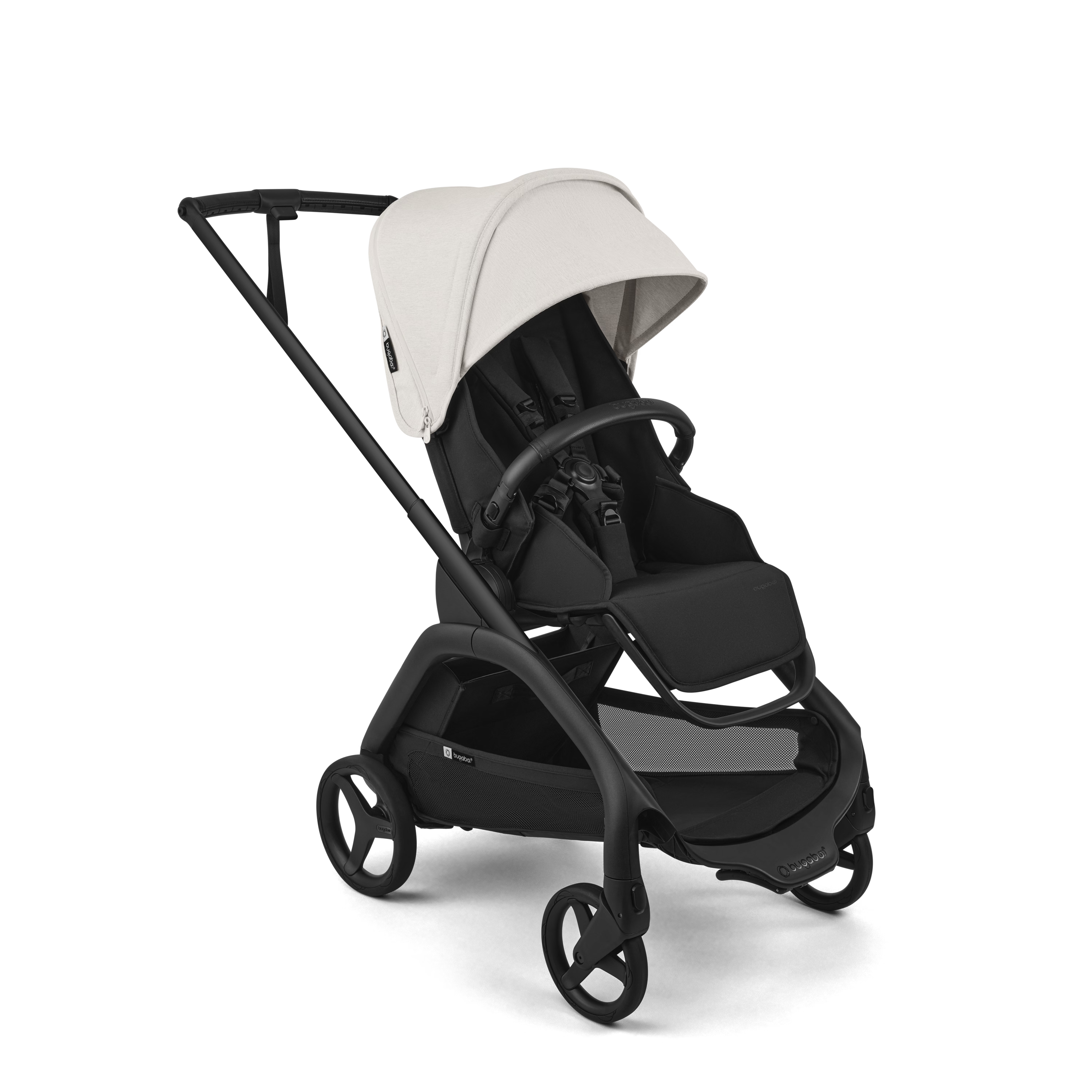 A modern stroller with a black frame and seat, featuring a light beige canopy and black wheels, shown on a clean white background.