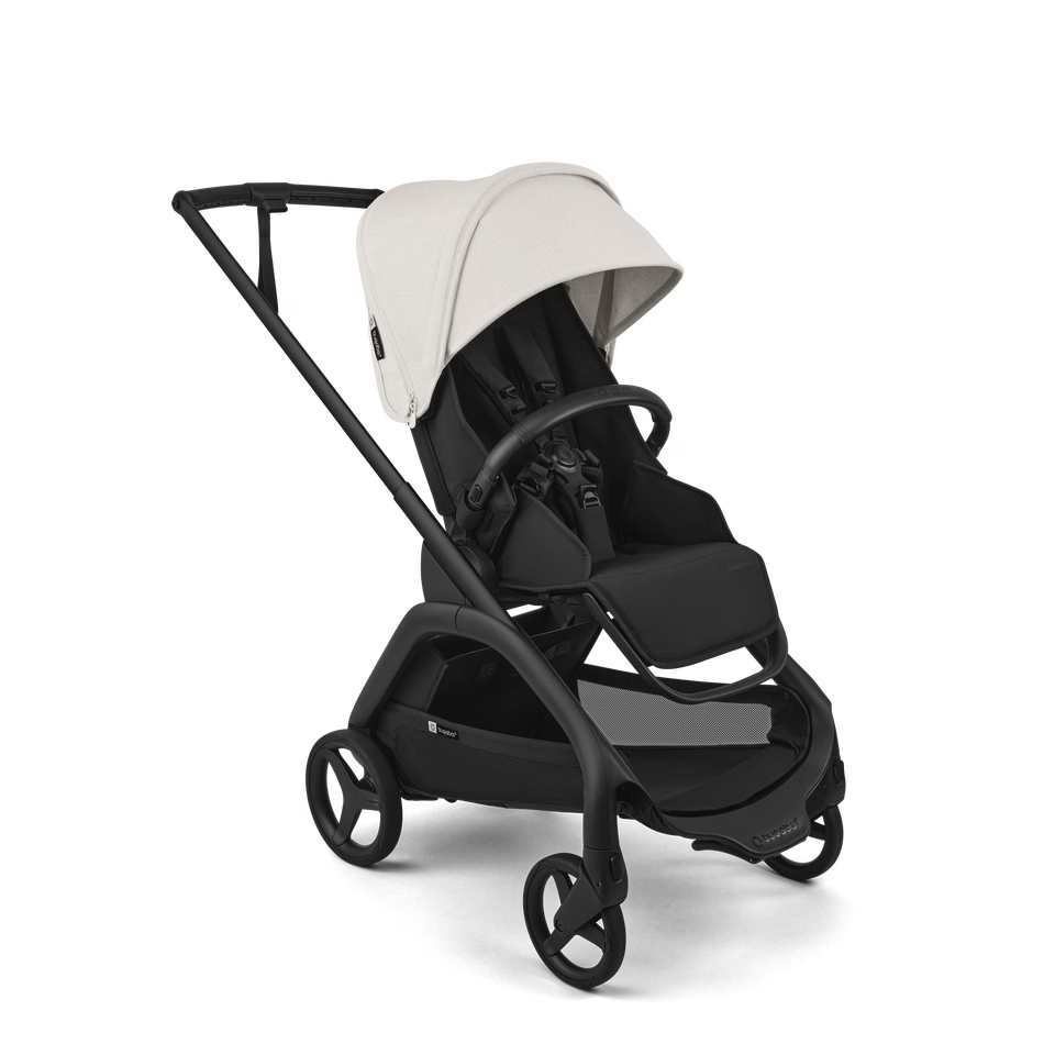 A modern stroller with a black frame and seat, featuring a light beige canopy and black wheels, shown on a clean white background.