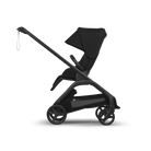 A black stroller shown in a side profile view against a clean white background. The stroller features a high-terrain style seat, a large adjustable canopy, a sleek frame, and three wheels.