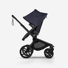 Black stroller with navy blue canopy on a white background