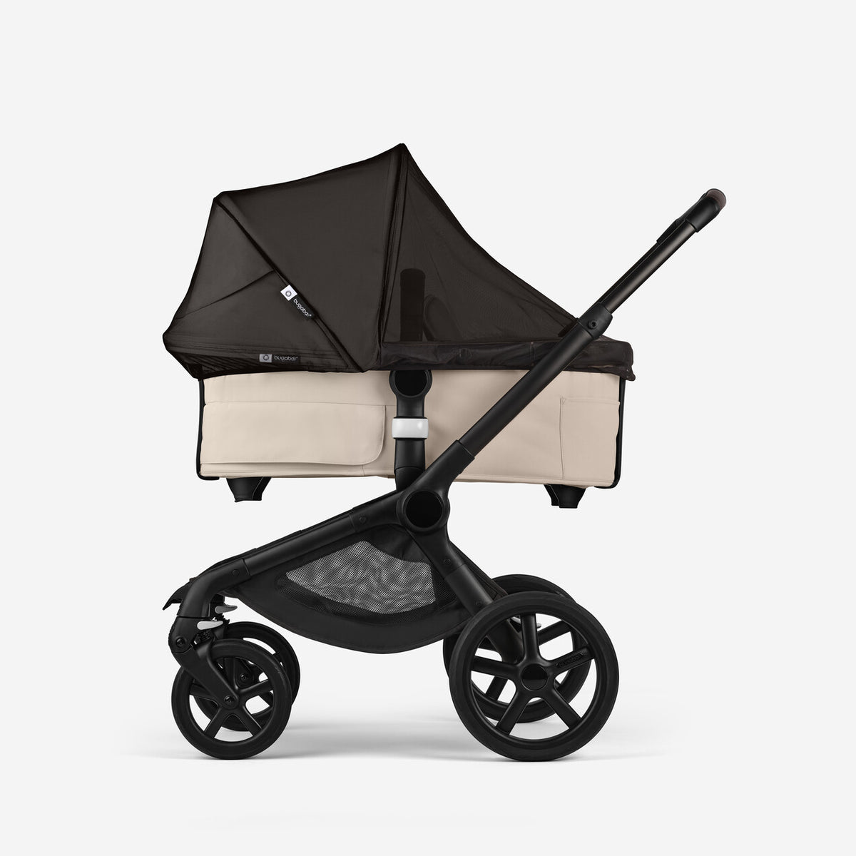 Black and beige baby stroller on a white background