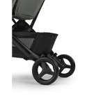 Close-up of a black stroller with wheels on a white background