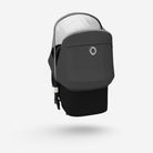 Black baby carrier with gray canopy on a white background