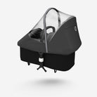 Black baby stroller with transparent canopy on a white background