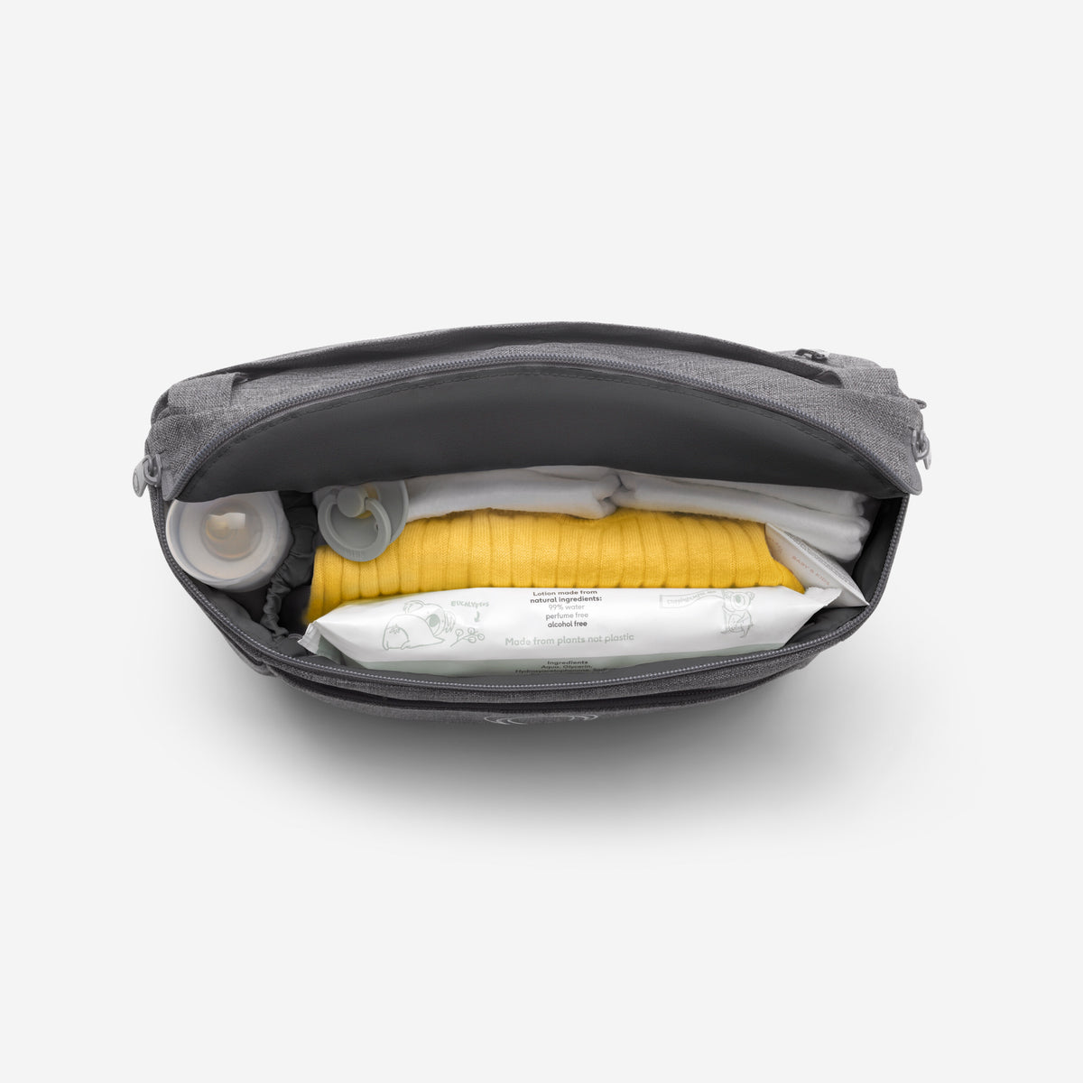 Black bag with yellow item on a white background