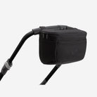 Black stroller accessory on a stroller handle with a white background