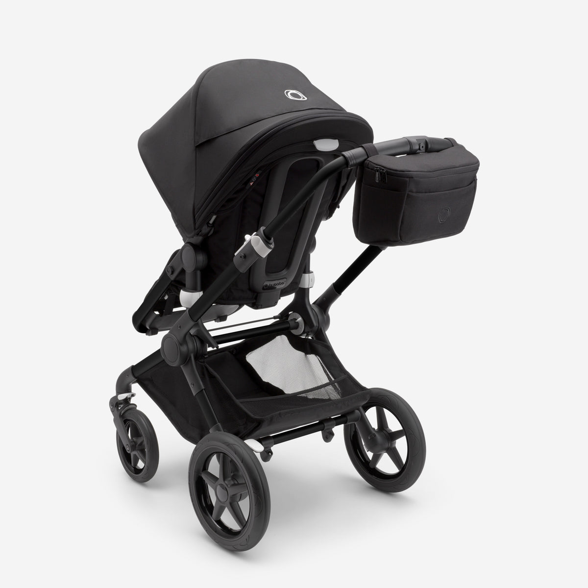 Black stroller with a black organizer and with a baby seat on a white background