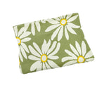 Floral-patterned pouch with white flowers and yellow centers on a green background