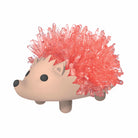 Plush toy hedgehog with pink spines on a white background