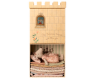 A Maileg toy set featuring an illustrated castle box with a lower compartment that opens to reveal a Big Sister mouse resting atop a tall stack of colorful layered mattresses.