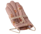 Baby bouncer with floral pattern on a white background
