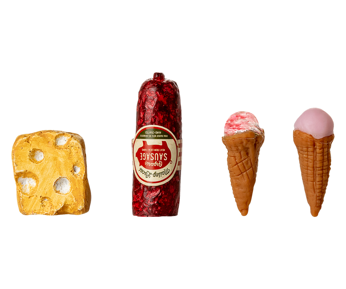 Four novelty items including a yellow cheese block, red sausage, and two ice cream cones with pink tops on a white background.