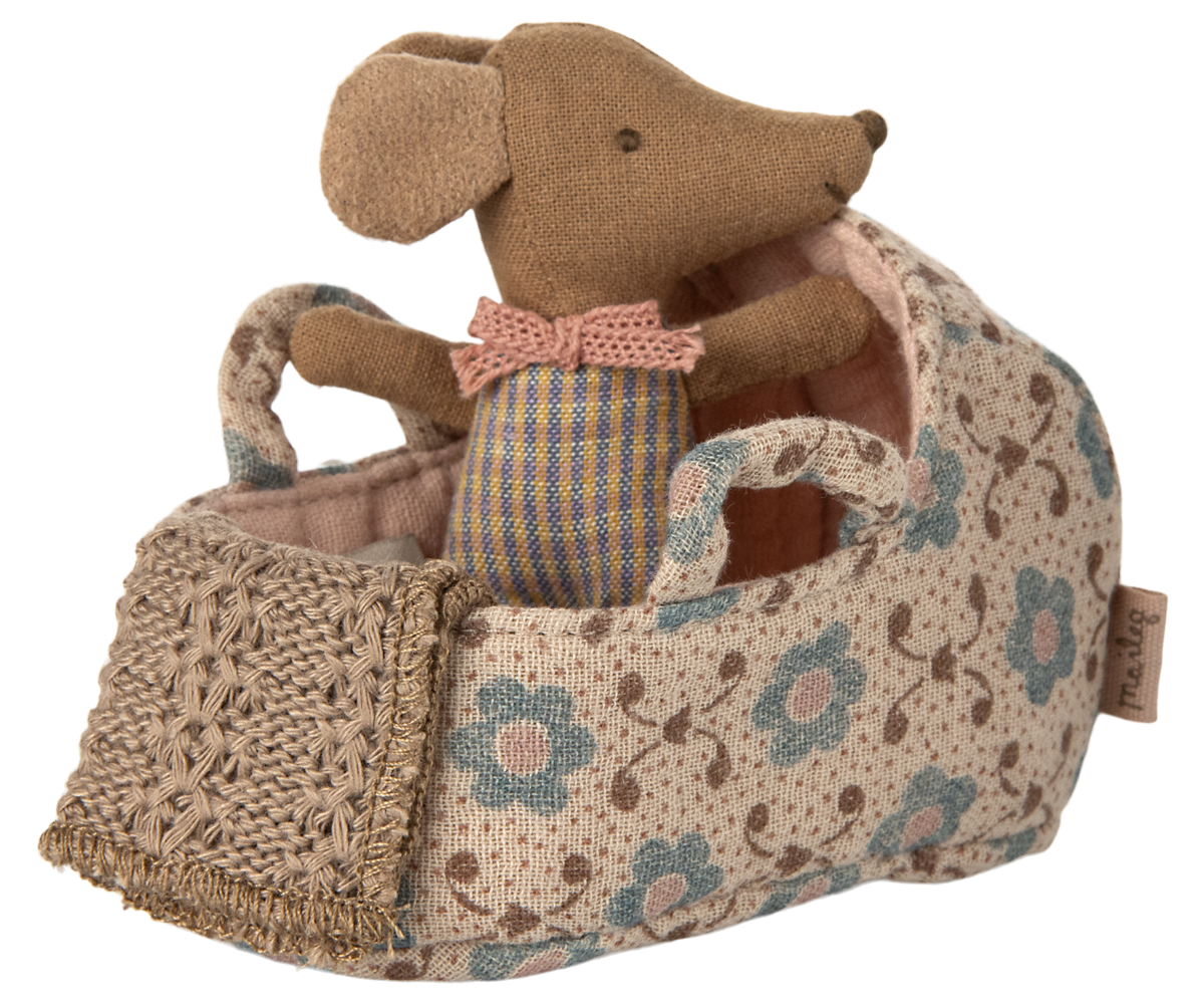 Stuffed mouse toy with a floral-patterned basket on a white background