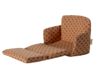Brown polka dot chair on a white background