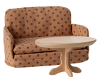 Polka dot sofa with a matching side table on a white background