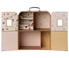 Children's toy chest with patterned doors on a white background
