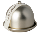 Metallic cheese dome with a white label on a white background