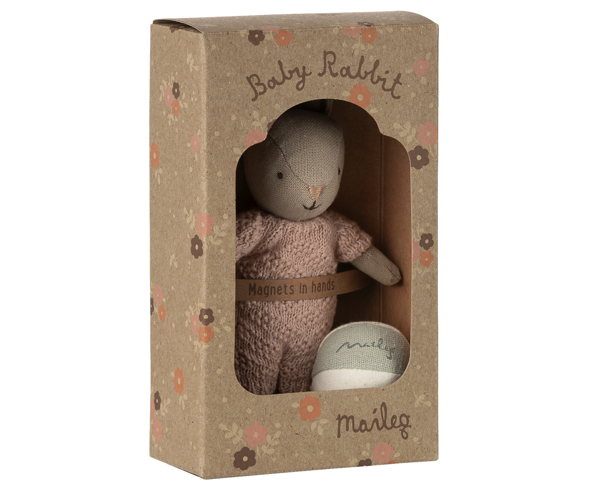 Knitted baby rabbit toy in a decorative box with 'Maileg' branding.
