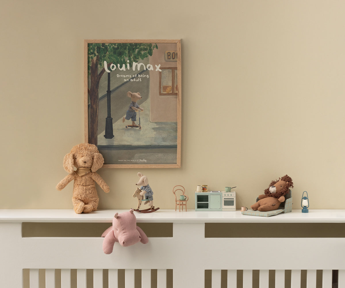 Children's room with toys on a shelf and a framed picture on the wall.