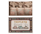 Matchbox with toy mice and decorative label on a white background
