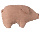 A soft, dusty pink linen stuffed pig toy with a simple stitched face and a small curled tail, viewed from the side against a transparent background.