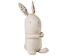Stuffed rabbit toy with patterned ears on a white background