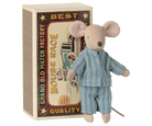 A toy mouse dressed in blue striped pyjamas, standing upright next to an open decorative matchbox labeled "Mouse Race Grand Old Match Factory."