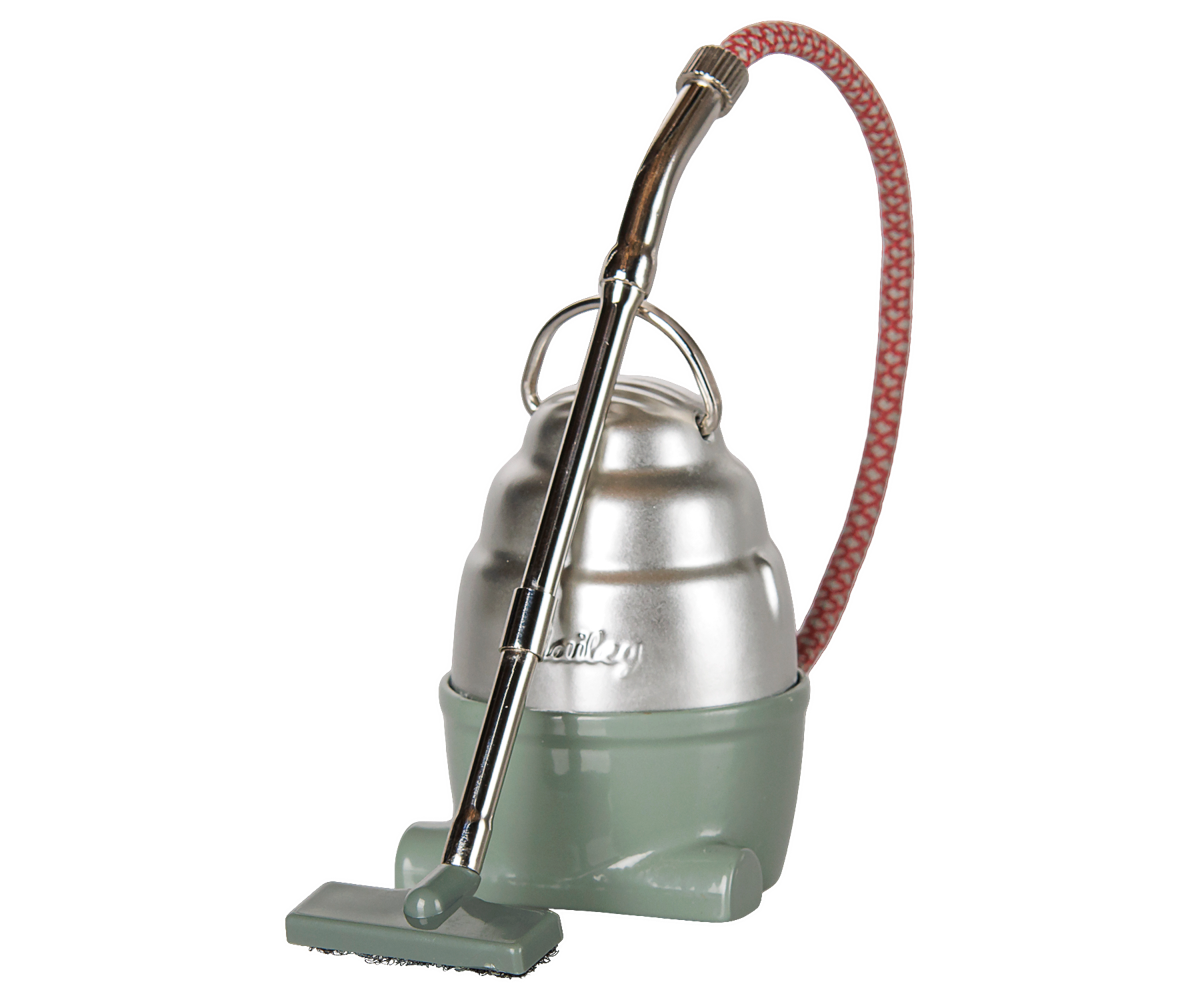 A product photo of the Vacuum Cleaner, Mouse - Dark Mint by Maileg against a transparent background, featuring a vintage-style mint green and silver canister body, a patterned red-and-white flexible fabric hose, and a metal handle with a tiny floor nozzle.