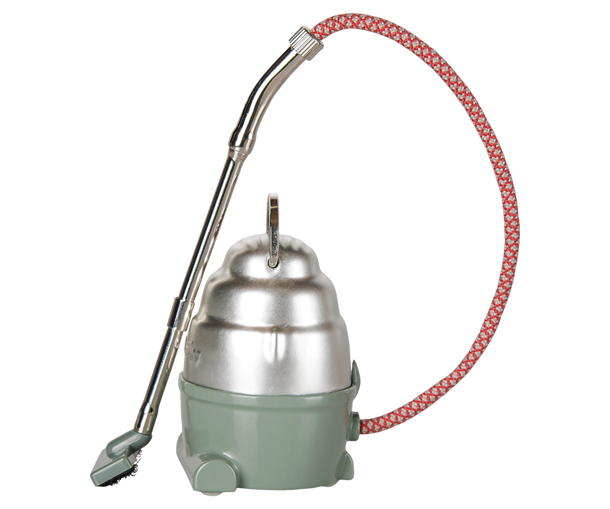 A product photo of the Vacuum Cleaner, Mouse - Dark Mint by Maileg against a transparent background, featuring a vintage-style mint green and silver canister body, a patterned red-and-white flexible fabric hose, and a metal handle with a tiny floor nozzle.
