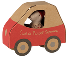 A Maileg Christmas Little Sister mouse wearing a festive red and white patterned knit sweater and a red pixy hat, peeking out from the window of a miniature cardboard car-shaped box labeled "Santa's Parcel Service" with red detailing and illustrated wheels.