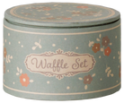 A round, vintage-style blue tin storage box for the Maileg Waffle Set, featuring a floral pattern, polka dots, and a decorative label that reads "Waffle Set."
