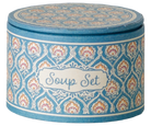 A product photo of the Soup Set, Mouse by Maileg packaging box, featuring a round, blue patterned container with a decorative label on the front that reads "Soup Set" in script lettering.
