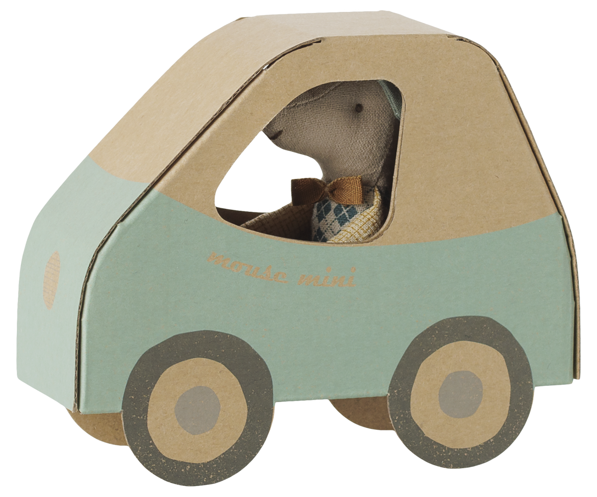A small plush toy mouse driving a cardboard car. The car is made of light brown cardboard with a mint green lower section and has the words 'mouse mini' printed on the side.