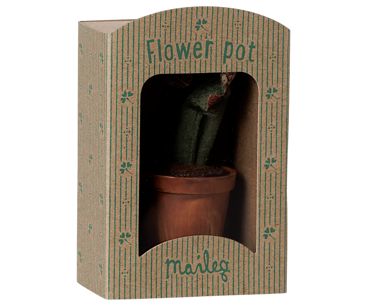 A miniature Maileg potted plant in decorative packaging designed to look like a tiny storefront or greenhouse box labeled "Flower pot" and "maileg."