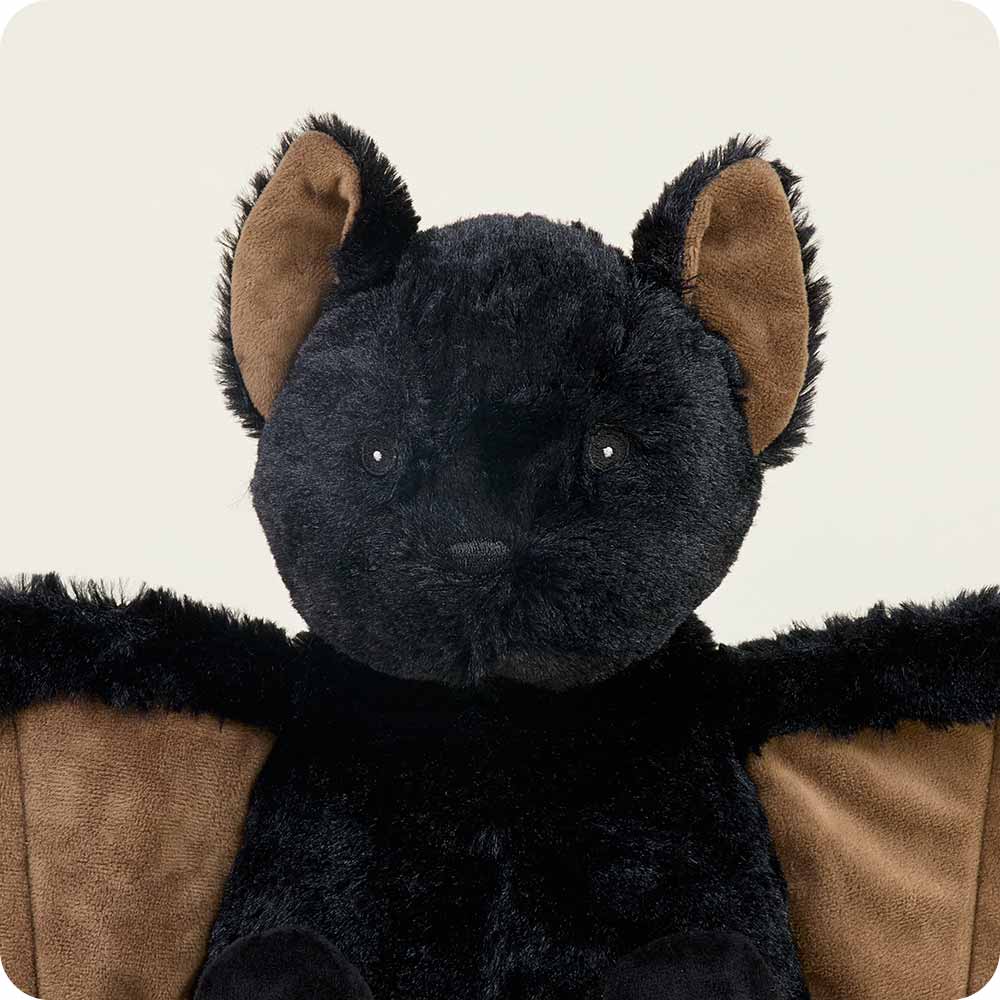Black plush toy with brown accents on a white background