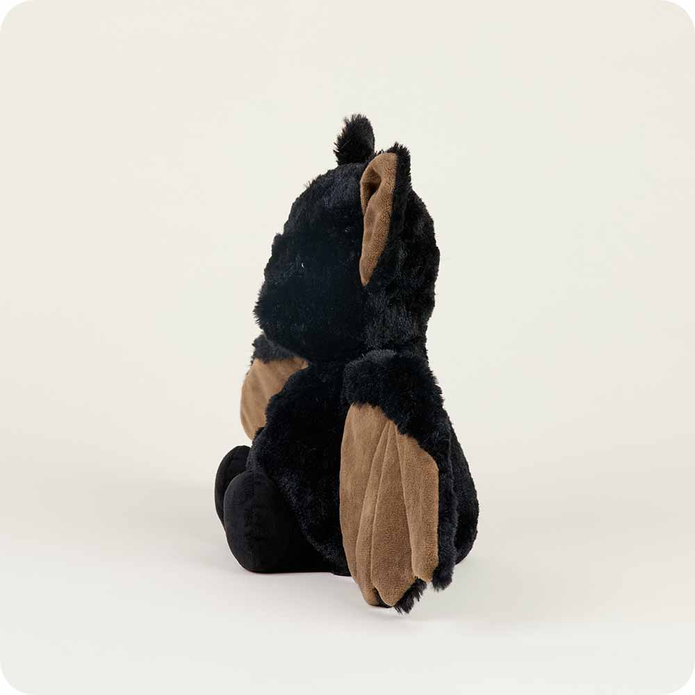 Plush toy bear with black fur and brown paws on a white background