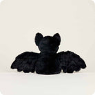 Black plush bat toy on a white background