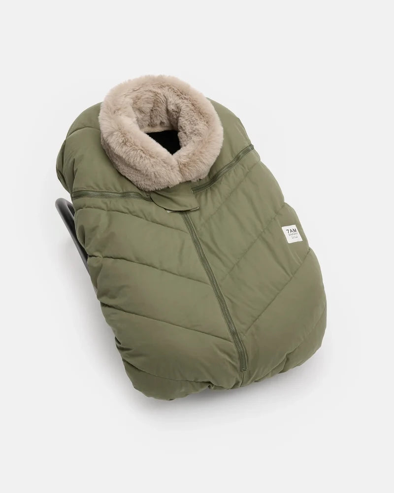 Woodland greige Helsinki Car Seat Cocoon by 7AM Enfant shown from a front angle, featuring a plush faux-fur collar and a quilted puffer texture.