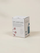White product packaging box with text and graphics on a beige background